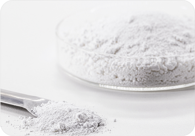 Magnesium powder on a white plate with a spoon. Magnesium supports nervous system function and helps regulate stress hormones, promoting calm and better sleep.